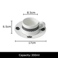Elegant black and white floral porcelain cup and saucer set dining room