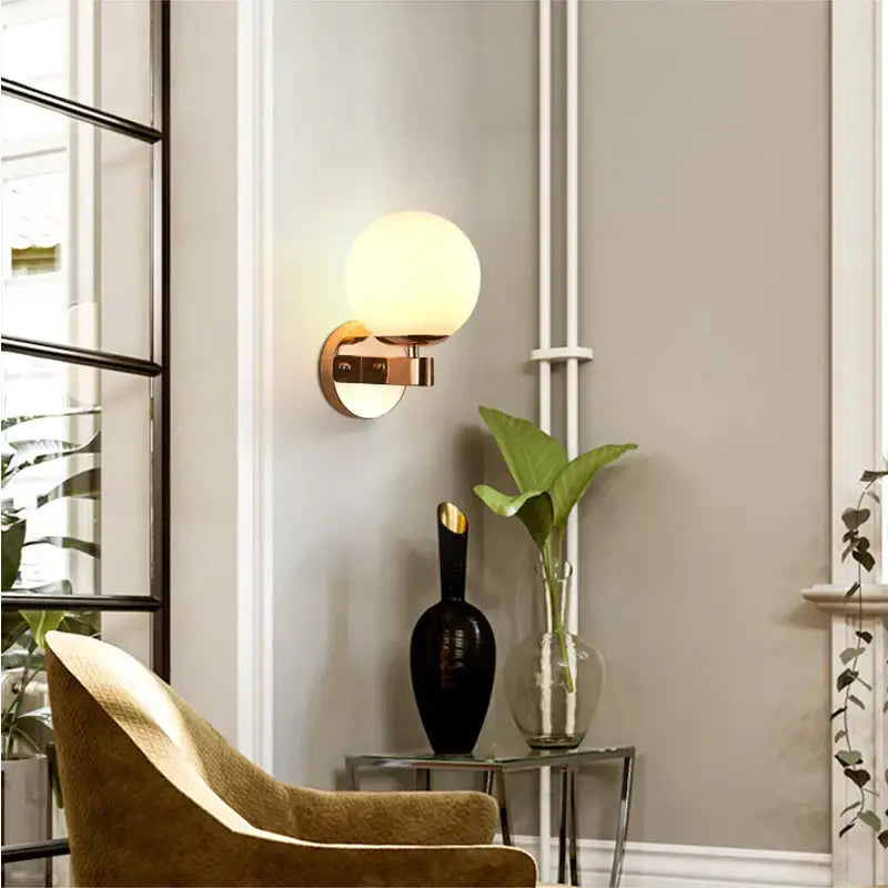 Elegant gold iron wall lamp with frosted glass shade for bedroom