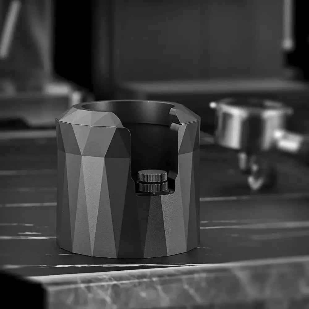 Faceted matte black metal espresso portafilter holder kitchen stand