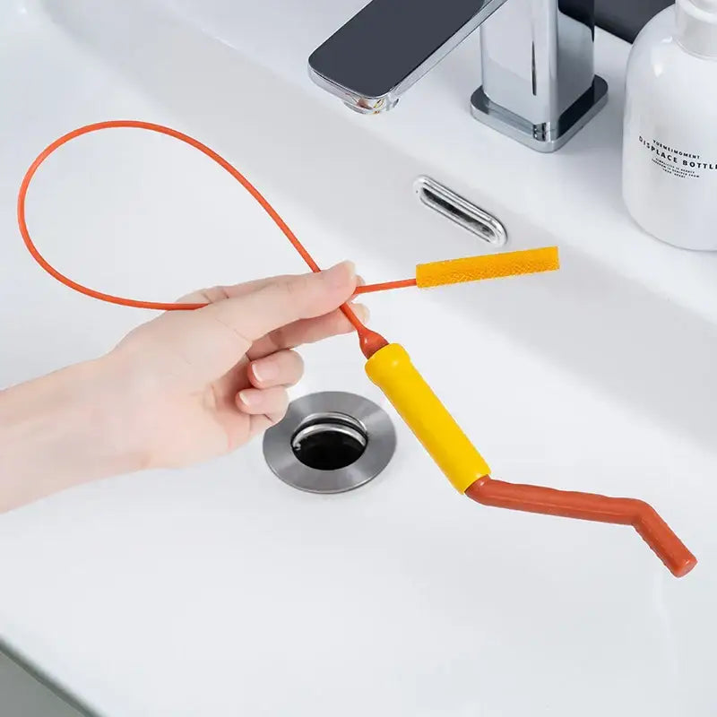 Flexible orange & yellow drain cleaner brush kitchen hair remover