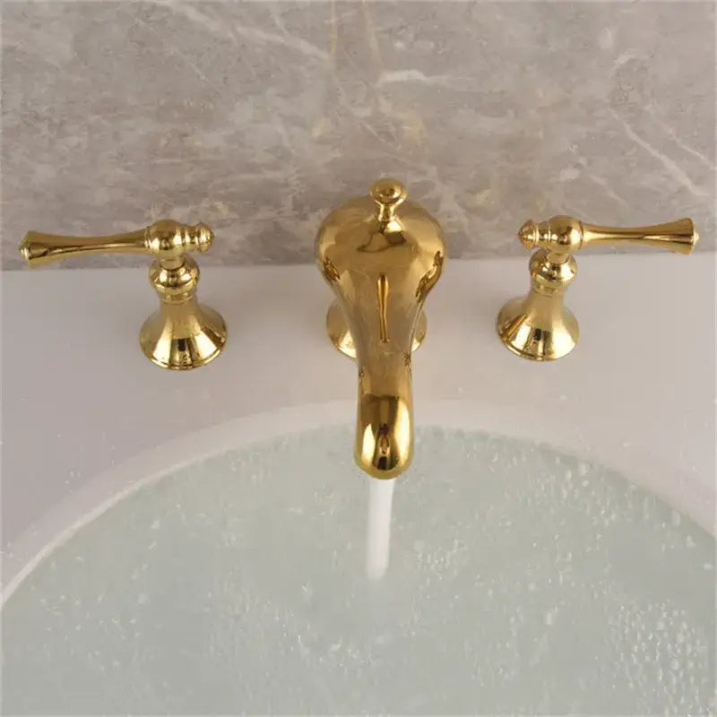 Gold widespread bathroom faucet waterfall design with lever handles