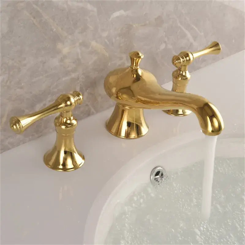 Gold widespread bathroom faucet waterfall design with lever handles