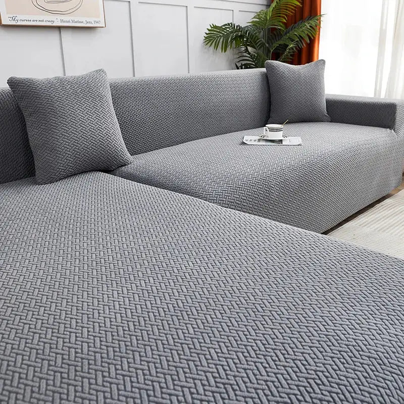 Gray textured jacquard sofa cover with pillows for living room