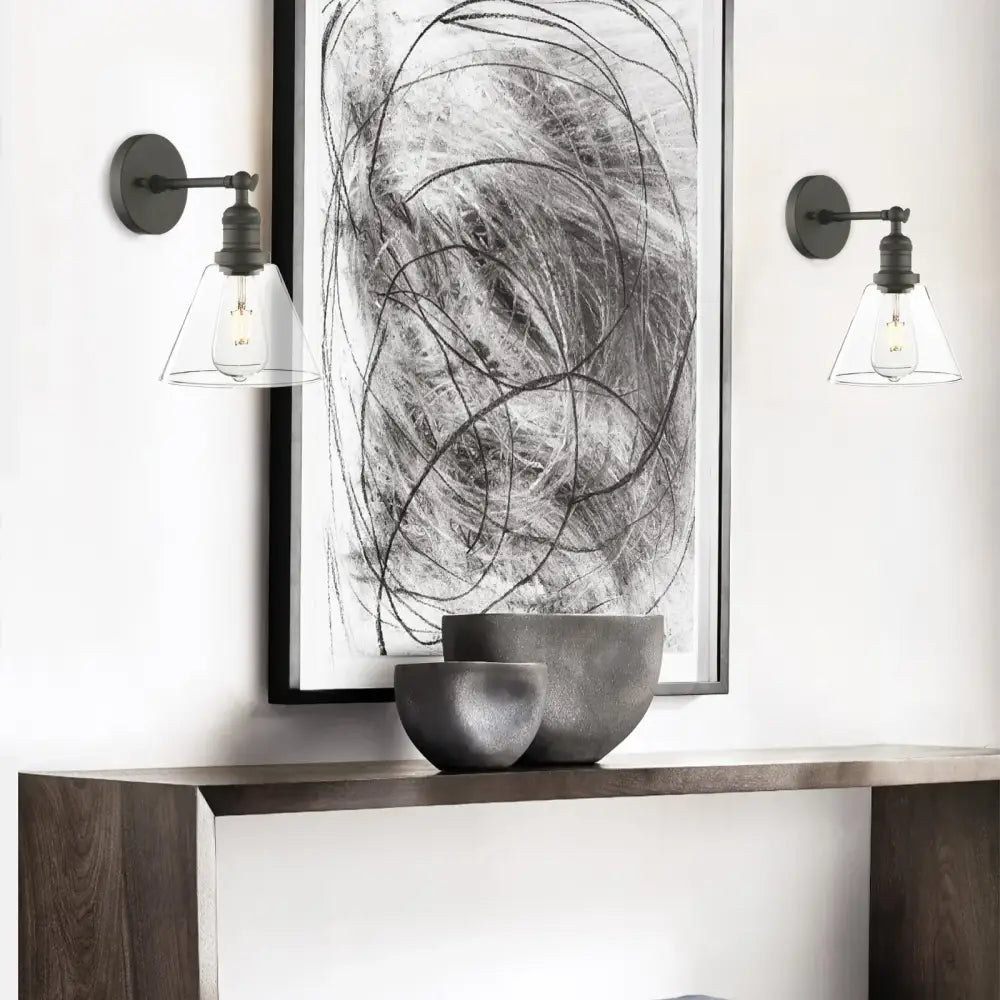 Industrial black wrought iron wall lamp with clear glass shade bedroom