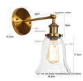 Industrial brass and clear glass wall sconce for bedroom