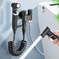 Matte black bidet spray set with coiled hose for bathroom