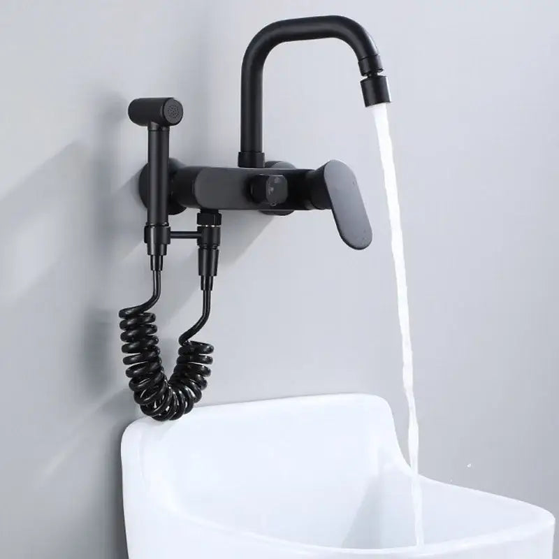 Matte black kitchen mixer tap with integrated handheld showerhead