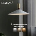 Minimalist gray and brass dimming pendant light for dining room