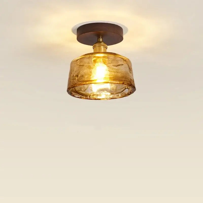 Modern amber glass and brass led ceiling lamp dining room
