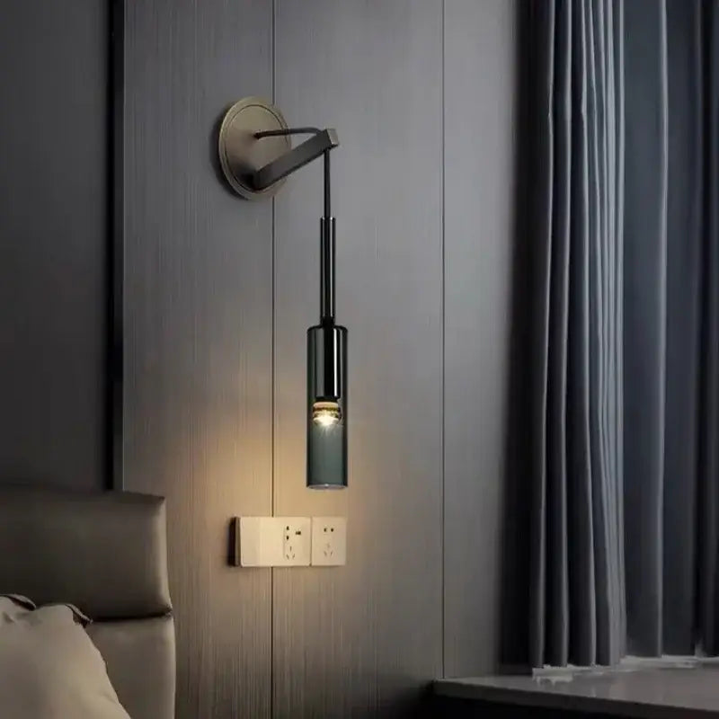 Modern black cylindrical wall sconce with frosted glass for bedroom