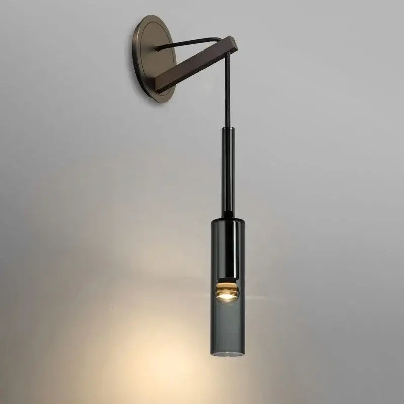 Modern black cylindrical wall sconce with frosted glass for bedroom