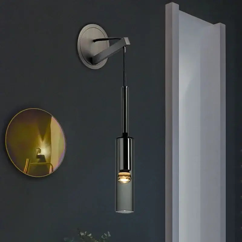 Modern black cylindrical wall sconce with frosted glass for bedroom
