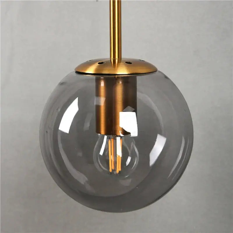 Modern brass glass ball wall lamp bedroom amber globe lighting