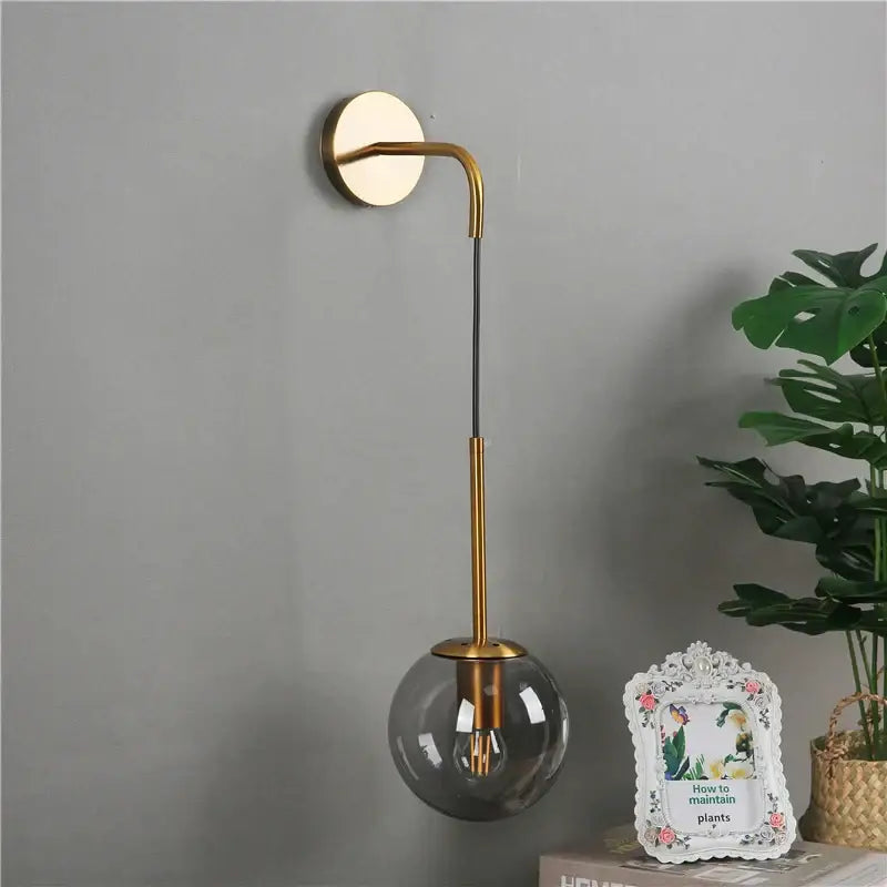 Modern brass glass ball wall lamp bedroom amber globe lighting