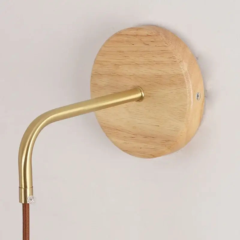 Modern copper and wood wall sconce with clear glass pull chain switch
