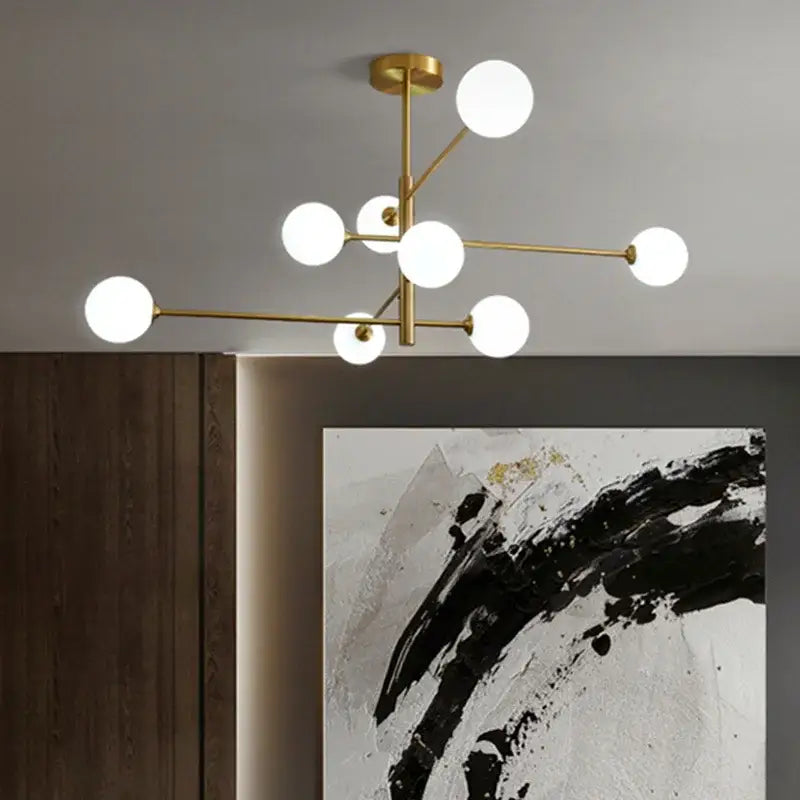 Modern geometric brass chandelier with frosted glass for living room