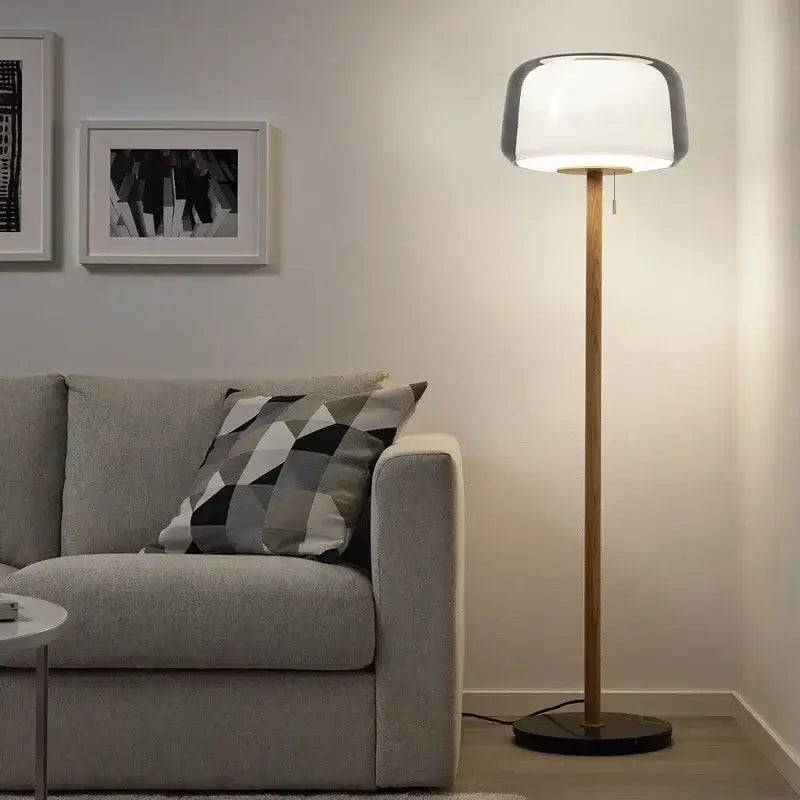 Modern glass floor lamp with wood pole for living room