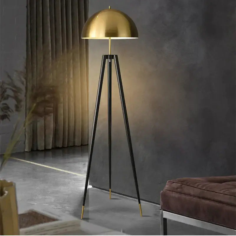 Modern gold and black tripod floor lamp living room decorbites coyote
