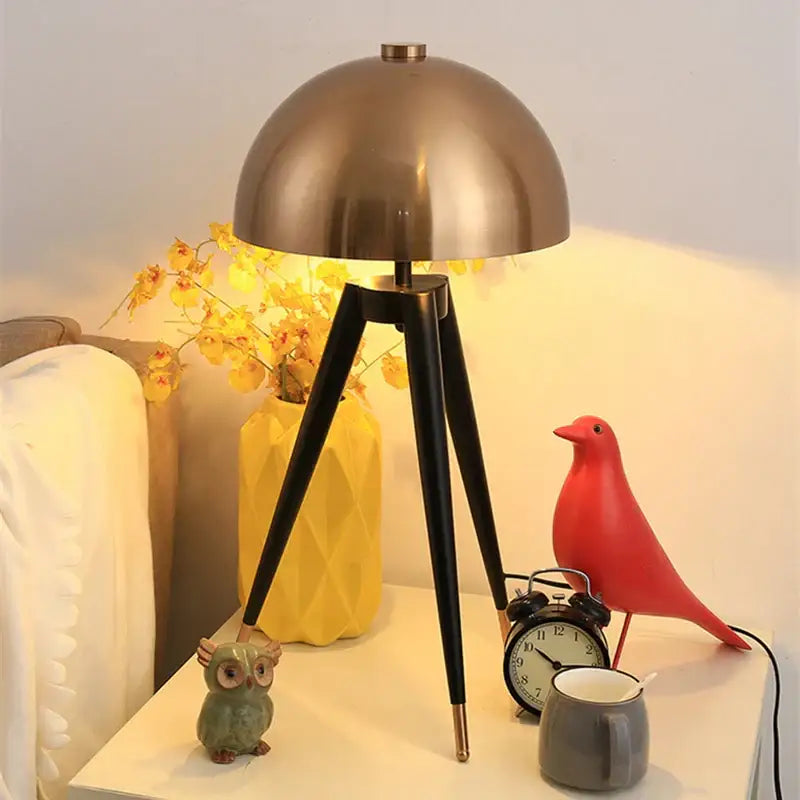 Modern gold and black tripod floor lamp living room decorbites coyote