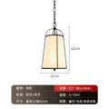 Modern gold & black pendant lights with fabric shades dining room