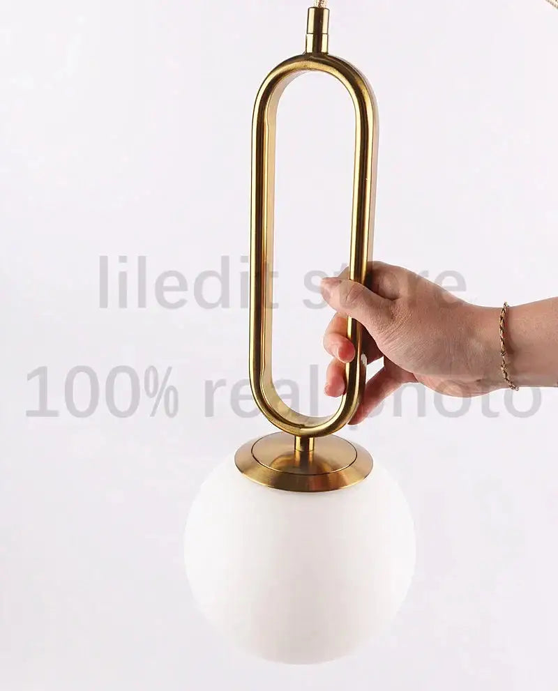 Modern golden glass ball pendant light for kitchen oval metal frame