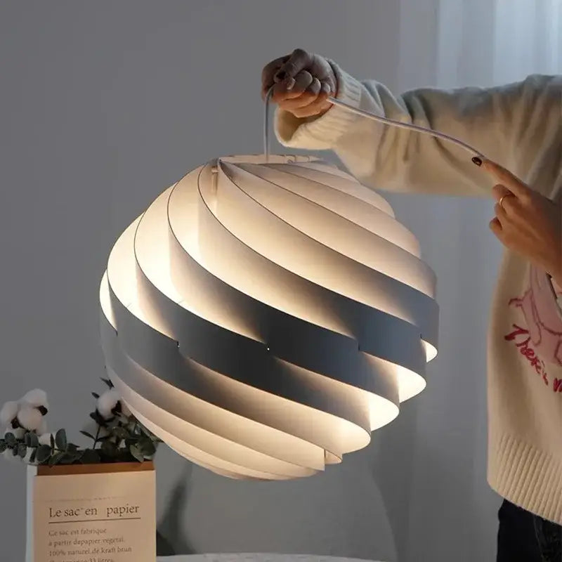 Modern white swirling spherical pendant light for dining room