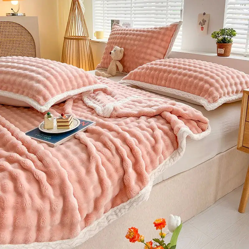 Pink and white textured cozy faux rabbit fur throw blanket bedroom