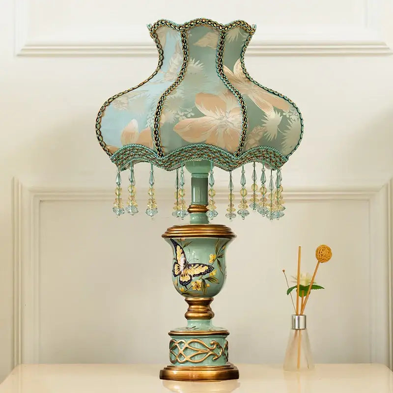 Retro mint green resin table lamp with butterfly detail bedroom light