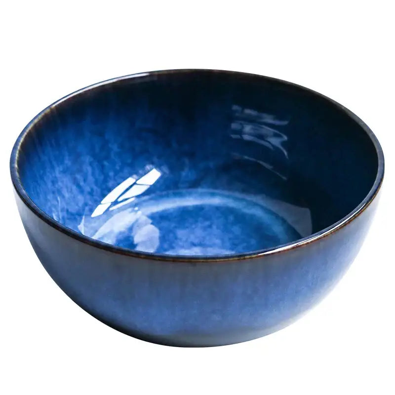 Rustic deep blue ceramic salad bowl with wooden fork dining room