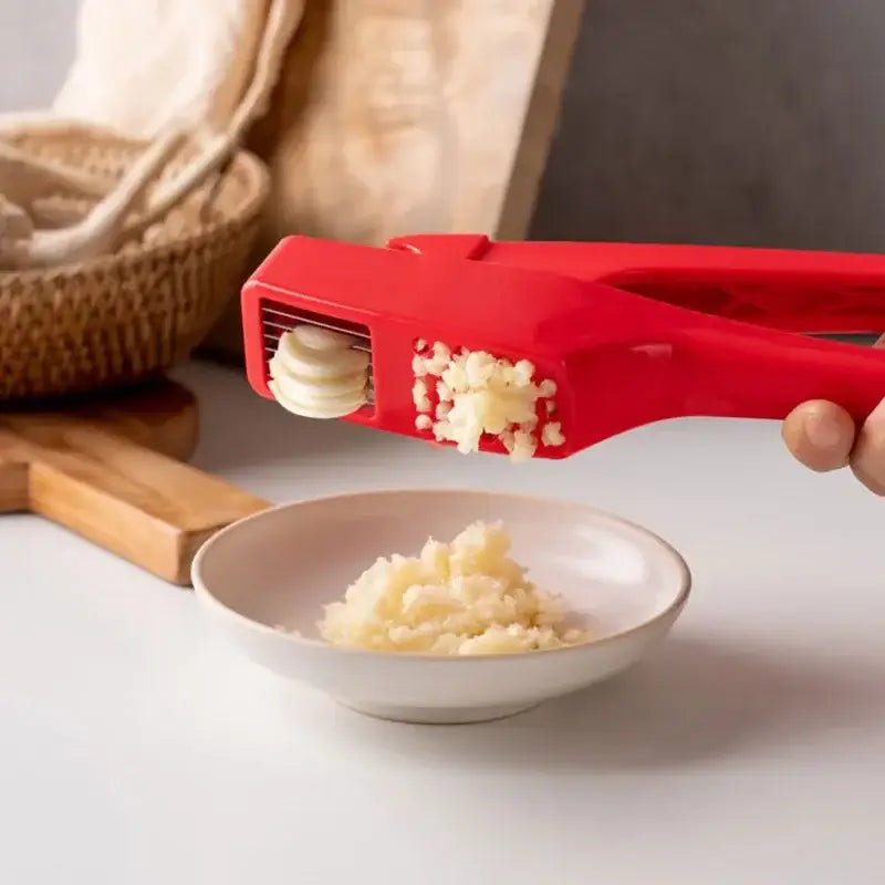 Sleek red manual press garlic crusher kitchen grinder