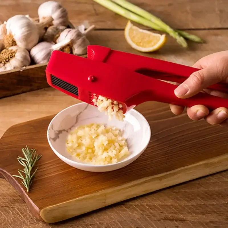 Sleek red manual press garlic crusher kitchen grinder